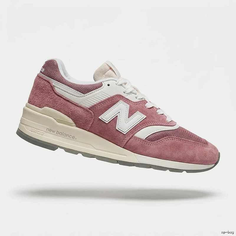 New Balance retro-style pink and white sports shoes